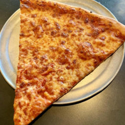 A slice of cheese pizza on a plate