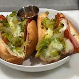 Two sandwiches with lettuce and sauce-Crustini pizza